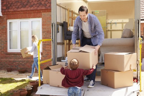 Removal team loading household furniture for an Eastfinchley removals service