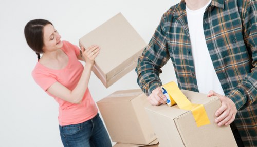 East Finchley moving service with packed boxes and transport van