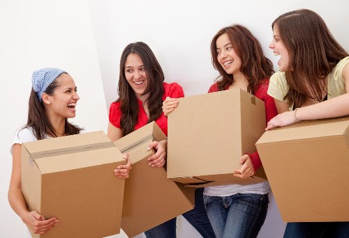 Careful packing of household items for a move in East Finchley