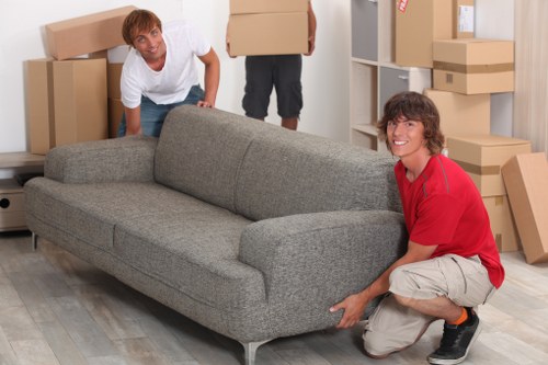 Professional movers handling boxes during same day removals
