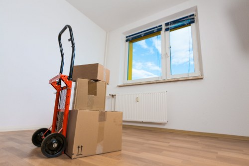 Professional moving truck service handling furniture in East Finchley